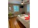 Bright bedroom with hardwood floors and two windows bringing in plenty of light at 1045 Nichols Dr, Raleigh, NC 27605