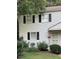 Charming two-story home with white siding, black shutters, and well-maintained landscaping at 1045 Nichols Dr, Raleigh, NC 27605