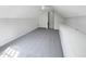 Wide shot of spacious bedroom with built-in storage and carpet; window offers natural light at 107 Kinship Ln, Apex, NC 27502