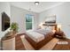 Staged primary bedroom featuring a large window and neutral decor at 107 Kinship Ln, Apex, NC 27502