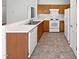Traditional kitchen featuring white countertops, wood cabinets, and standard appliances at 107 Kinship Ln, Apex, NC 27502