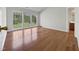 Spacious living area with hardwood floors and large windows offering natural light at 107 Kinship Ln, Apex, NC 27502