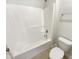 Clean bathroom featuring a bright white tub-shower with matching toilet at 108 Warm Wood Ln, Apex, NC 27539