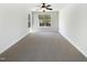 A spacious bedroom features carpet, neutral walls, ceiling fan, and plenty of sunlight at 108 Warm Wood Ln, Apex, NC 27539