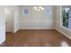 Formal dining room with hardwood floors and plenty of natural light for entertaining at 108 Warm Wood Ln, Apex, NC 27539