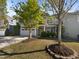 Charming two-story home featuring a well-manicured lawn and a two-car garage at 108 Warm Wood Ln, Apex, NC 27539