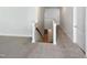Hallway with a staircase to the first floor showcasing plush, neutral carpet at 108 Warm Wood Ln, Apex, NC 27539