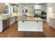 Gourmet kitchen boasts stainless appliances, granite countertops, and a large center island at 108 Warm Wood Ln, Apex, NC 27539