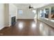 Open concept living room with hardwood floors, a fireplace, and lots of natural light at 108 Warm Wood Ln, Apex, NC 27539