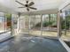 Light filled screened in porch with walls of windows to view nature at 108 Warm Wood Ln, Apex, NC 27539