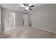 Spacious bedroom with neutral paint, carpet, ceiling fan and convenient access to bathroom at 1106 Lake Ridge Dr, Creedmoor, NC 27522