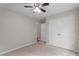 Neutral bedroom featuring a carpeted floor, a ceiling fan, and a double door closet at 1106 Lake Ridge Dr, Creedmoor, NC 27522