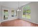 Bright breakfast nook with large windows offering backyard views and door to the outside at 1106 Lake Ridge Dr, Creedmoor, NC 27522