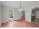 Dining room featuring stylish light fixture, wood floors and great natural lighting at 1106 Lake Ridge Dr, Creedmoor, NC 27522