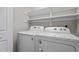 Laundry room equipped with a modern washer and dryer, and floating shelves at 1106 Lake Ridge Dr, Creedmoor, NC 27522