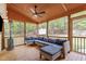 Inviting screened patio featuring comfortable seating and wood flooring and ceiling at 1106 Lake Ridge Dr, Creedmoor, NC 27522