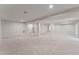 Spacious finished basement with carpet and recessed lighting at 1216 Edgemoore Trl, Wake Forest, NC 27587