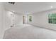 Large bedroom with walk in closet, windows and neutral carpet at 1216 Edgemoore Trl, Wake Forest, NC 27587