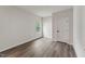 Bright bedroom with hardwood floors and a window at 1216 Edgemoore Trl, Wake Forest, NC 27587