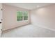 Pink bedroom with window and plush carpet at 1216 Edgemoore Trl, Wake Forest, NC 27587