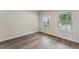Bedroom with wood look flooring and windows at 1216 Edgemoore Trl, Wake Forest, NC 27587