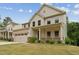 Charming two-story home with a covered front porch and attached garage at 1216 Edgemoore Trl, Wake Forest, NC 27587