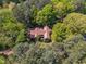 Stunning aerial perspective of a home nestled among lush greenery and mature trees at 1318 Indian Camp Rd, Chapel Hill, NC 27516