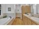 Bathroom with a soaking tub, a separate glass shower, and double sink vanity at 1318 Indian Camp Rd, Chapel Hill, NC 27516