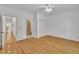 A bright and spacious bedroom with hardwood floors, closet, and ensuite at 1318 Indian Camp Rd, Chapel Hill, NC 27516
