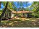 Aerial view of a beautiful home with a manicured lawn and lush landscaping at 1318 Indian Camp Rd, Chapel Hill, NC 27516