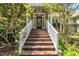 Inviting front entrance with well-maintained stairs and landscaped surroundings at 1318 Indian Camp Rd, Chapel Hill, NC 27516