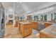 Open-concept kitchen features custom cabinets, tile countertops, and plenty of natural light at 1318 Indian Camp Rd, Chapel Hill, NC 27516