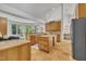 Bright kitchen features wood cabinets, spacious countertops, and ample natural light at 1318 Indian Camp Rd, Chapel Hill, NC 27516