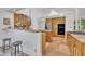 Well appointed kitchen with stainless appliances, cooktop and island seating at 1318 Indian Camp Rd, Chapel Hill, NC 27516