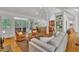 Spacious open-plan living area with comfortable seating and seamless transition to the kitchen and outdoor deck at 1318 Indian Camp Rd, Chapel Hill, NC 27516