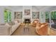 Cozy living room with fireplace, built-in shelving, comfortable seating, and natural light at 1318 Indian Camp Rd, Chapel Hill, NC 27516