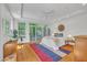 Sun-filled bedroom with hardwood floors and large windows that bring nature inside at 1318 Indian Camp Rd, Chapel Hill, NC 27516
