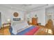 Bright bedroom with hardwood floors, tray ceiling, and a ceiling fan for added comfort at 1318 Indian Camp Rd, Chapel Hill, NC 27516