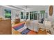 Inviting bedroom with hardwood floors, large windows, and a serene, natural atmosphere at 1318 Indian Camp Rd, Chapel Hill, NC 27516