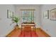Bright home office with desk, hardwood floors, rug, and window with blinds at 1318 Indian Camp Rd, Chapel Hill, NC 27516
