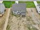 Back of a gray two-story home with a screened porch from above at 138 Alden Way, Angier, NC 27501
