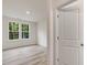 Bright bedroom features a view of nature through large windows and stylish flooring at 138 Alden Way, Angier, NC 27501