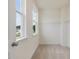 Walk-in closet with ample shelving and natural light from the two windows at 138 Alden Way, Angier, NC 27501