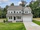 Beautiful two-story home with a welcoming front porch and attached garage at 138 Alden Way, Angier, NC 27501