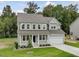 Charming two-story home with a welcoming front porch and attached garage at 138 Alden Way, Angier, NC 27501