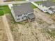 Aerial view of a gray home with a screened in porch and lawn at 138 Alden Way, Angier, NC 27501