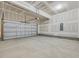 Spacious unfinished garage with new concrete flooring and a modern garage door at 138 Alden Way, Angier, NC 27501