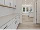 Bright kitchen with white cabinets, light counters and stainless appliances at 138 Alden Way, Angier, NC 27501