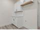 Laundry room with white cabinets and light counters at 138 Alden Way, Angier, NC 27501