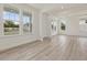 Bright open living room with multiple windows and a light wood floor at 138 Alden Way, Angier, NC 27501